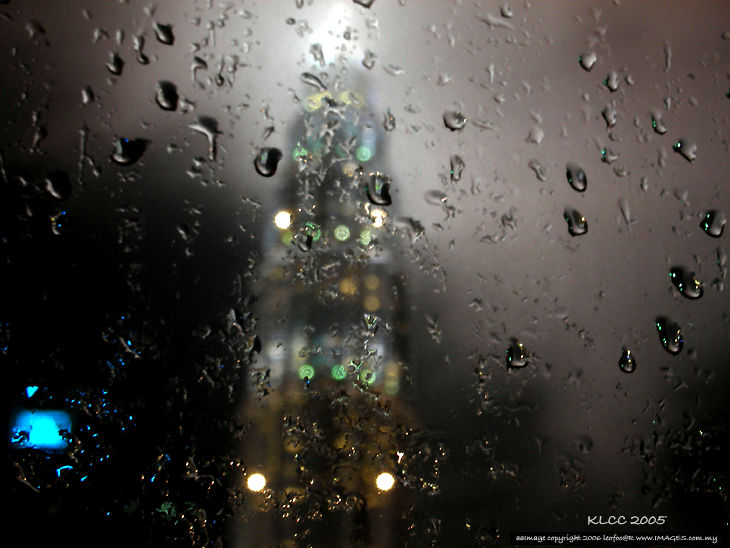 Petronas Twin Towers through the window in the rain