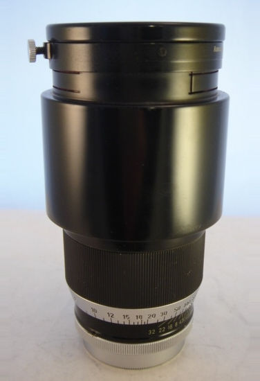Ernst Leitz Wetzlar TELYT 200mm f/4.5 lens side view with lens hood inversely stored