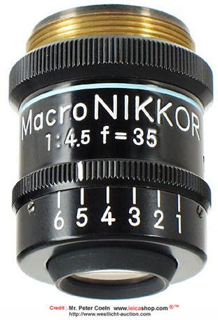 A vertical front view of a Nippon Kogaku /Nikon Macro-NIKKOR 1:4.5 f=35mm (blue-lined R-Ratio 8X~20X) lens