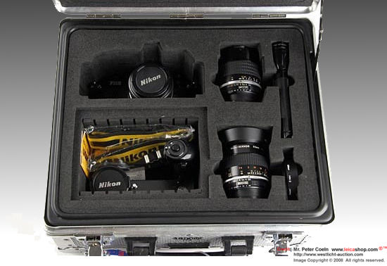 Nikon FM2N black Tropical Edition set inside the compartment with all system acccessories supplied