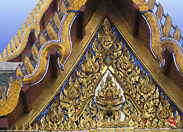 Delicate details of wood crafting at the top of the temple of Wat Suthat