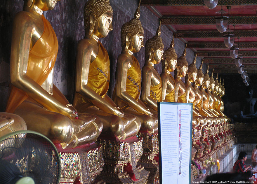 The hundreds of life size Buddha Statues arranged in rows at  the smammer chapel around the main Viharn of Wat Suthat