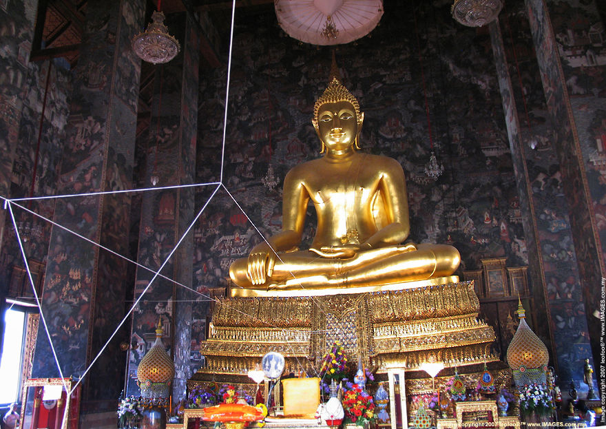 A manificent view of the Phra Sri Sakayamunee Buddha Statue inside the Viharn of Wat Suthat Buddhist Temple in Bangkok, Thailand