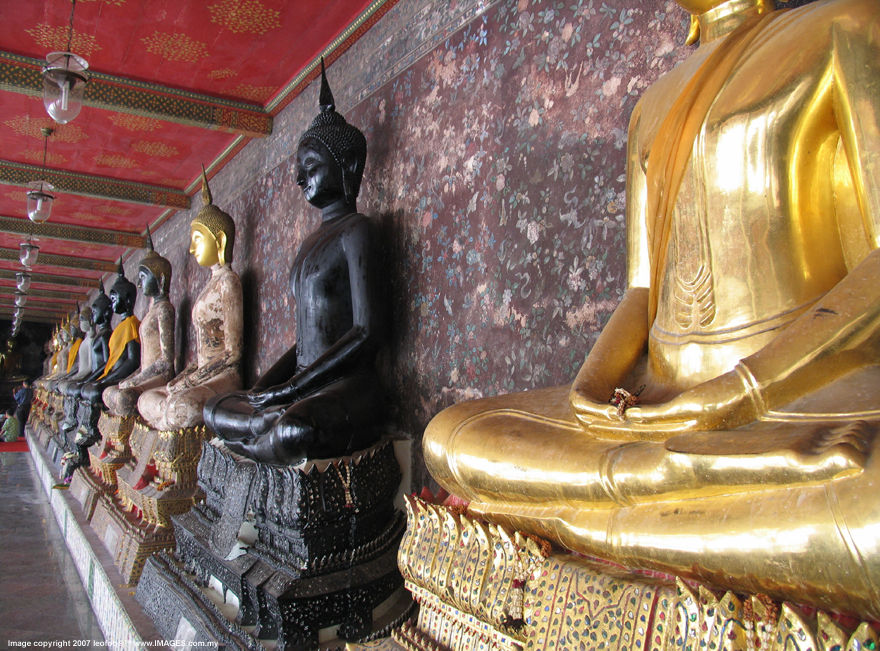 The various Buddha statues around the mini chapel around Wat Suthat Buddhist Temple