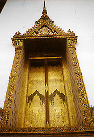 The famous King made wood carving entrance door to the Royal Chapel of Wat Suthat