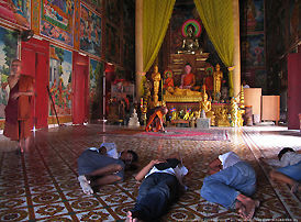 The homeless who occupy the center stage of a buddhist temple in Cambodia