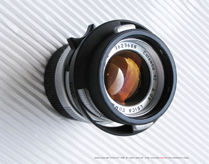 Front view of the dedicated Special edition Summicron-M 50mm f/2.0 Colombo '92 edition with dedicated lens hood stored in reversed position