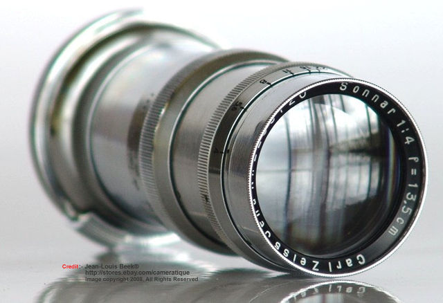 Side view with front lens element and reflective coating of Carl Zeiss JENA Sonnar 1:4 f=13.5cm (135mm f/4.0) medium telephoto lens